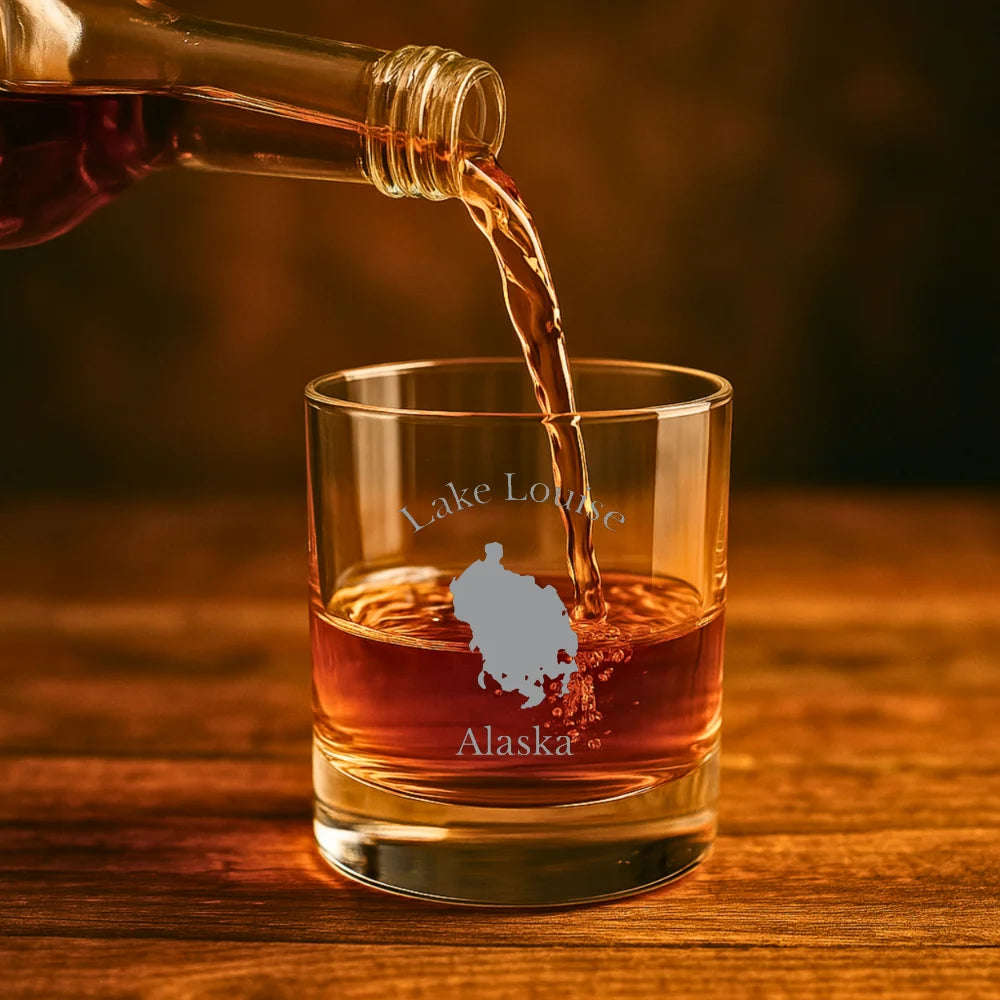 lifestyle image of Lake Louise Alaska Engraved Whiskey Glass