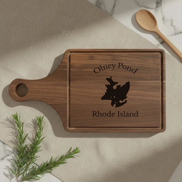 lifestyle image of Olney Pond Rhode Island Engraved Cutting Board